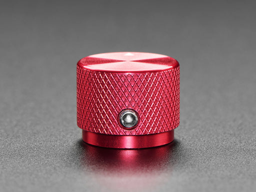 Angled shot of a red aluminum knob. A white triangle on top of the knob points at 7:00. 