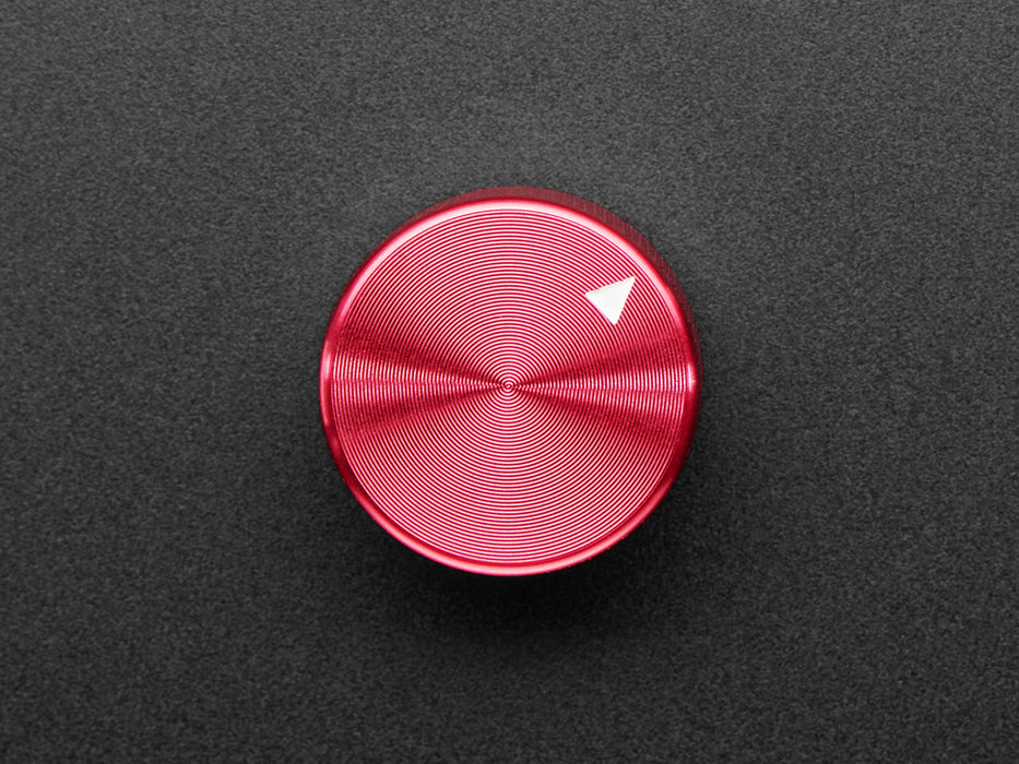 Angled shot of a red aluminum knob. A white triangle on top of the knob points at 7:00. 