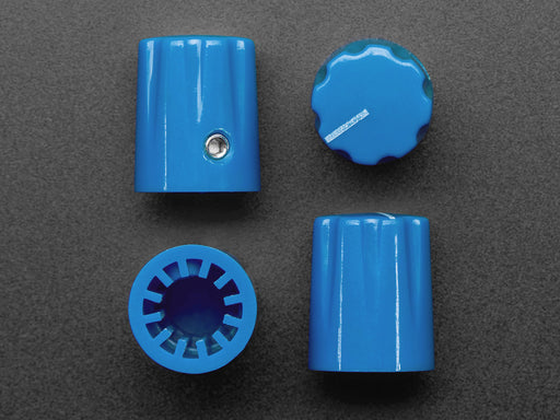 Angled shot of four blue plastic micro knobs.