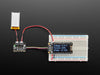 Top view of LiPoly / LiIon Fuel Gauge and Battery Monitor powered by a Lipoly battery and an OLED display.