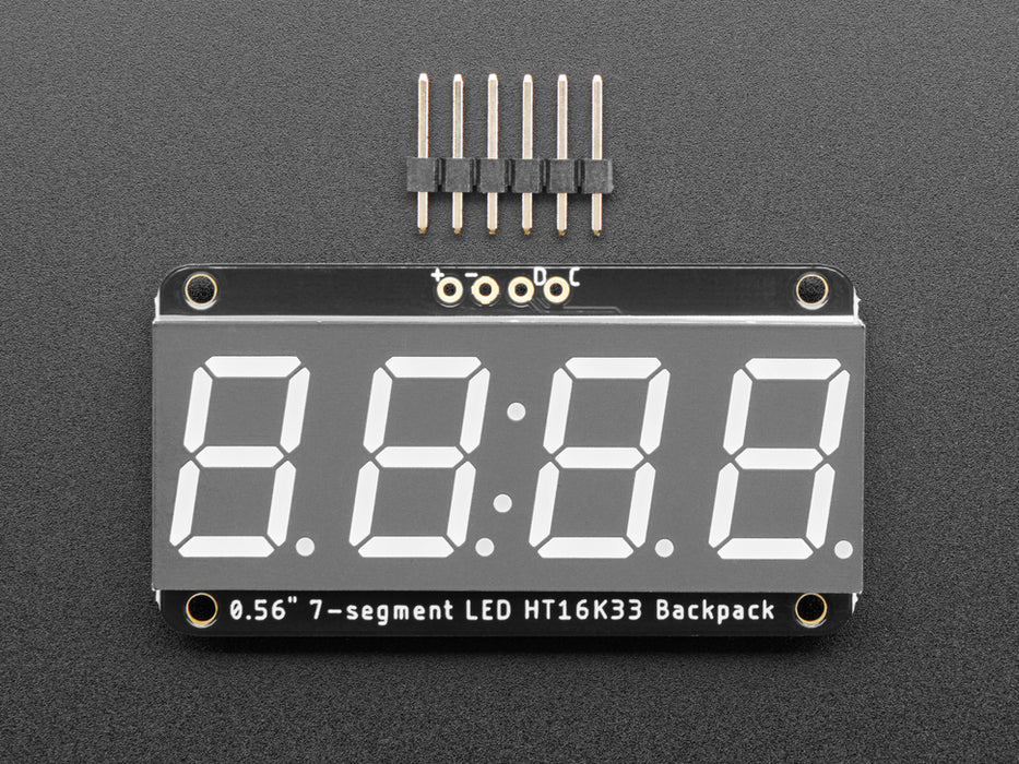 Red 7-segment clock display soldered to backpack with all segments lit