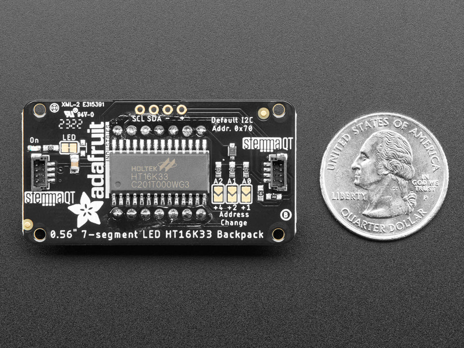 Red 7-segment clock display soldered to backpack with all segments lit