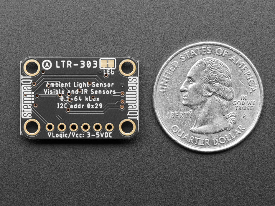 Overhead video of a light sensor connected to an OLED screen breakout, which displays infrared and visibility data.