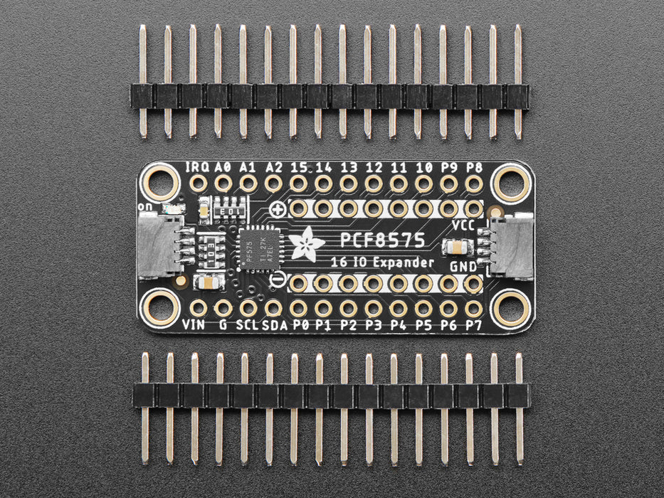 Overhead video of a GPIO expander breakout wired to two LEDs and a microcontroller on a breadboard. A hand presses a button on the bottom of the GPIO expander, individually lighting up the yellow and blue LEDs. 