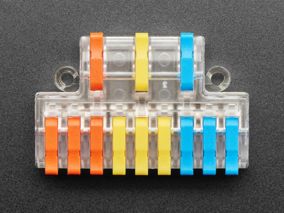 Angled shot of 3-to-9 Wiring Block Connector assembled with blue, yellow, and red wires.