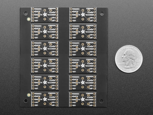 Overhead shot of PCB panel contain two rows of five step-switch breakouts.