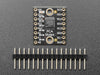 Angled shot of small, black, square I2C multiplexer.