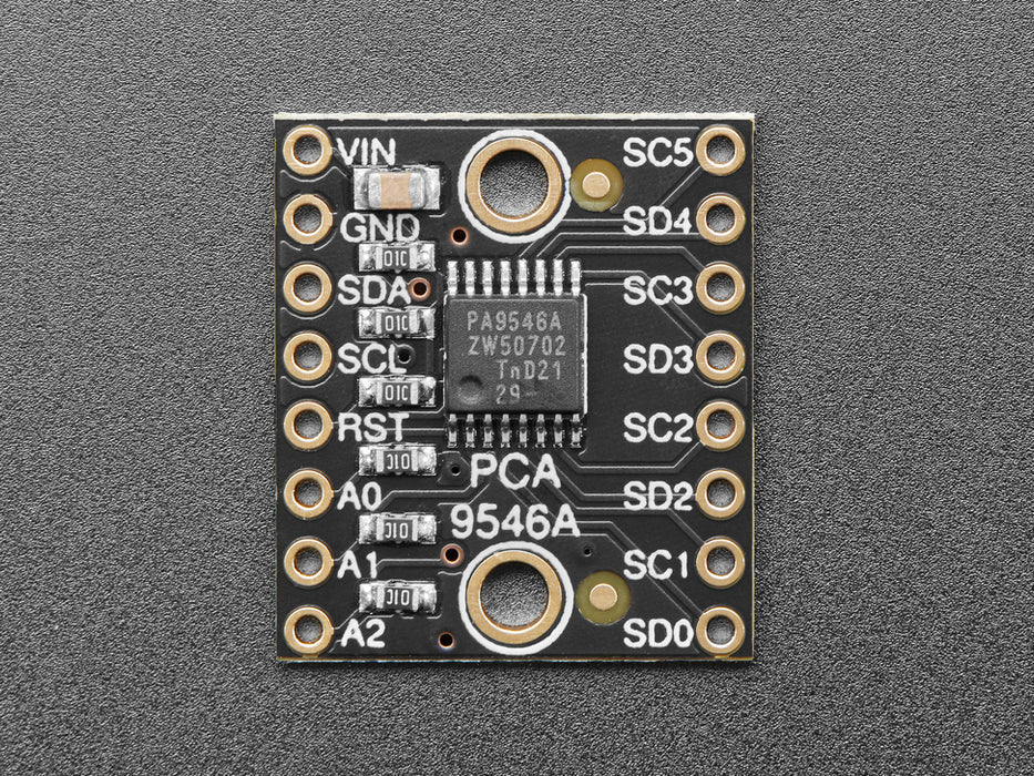 Angled shot of small, black, square I2C multiplexer.