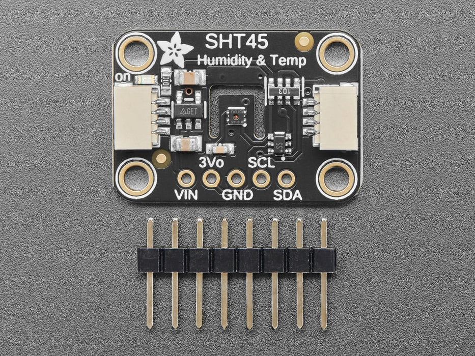 Angled shot of black rectangular temperature-humidity sensor breakout.