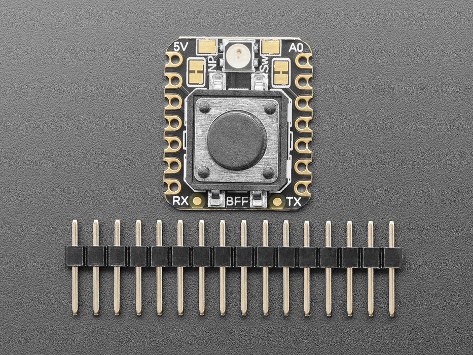 Angled shot of a square-shaped breakout board with an on-off button.