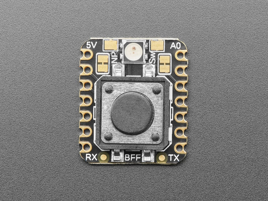 Angled shot of a square-shaped breakout board with an on-off button.