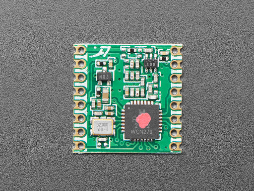 Angled shot of green LoRa radio module.