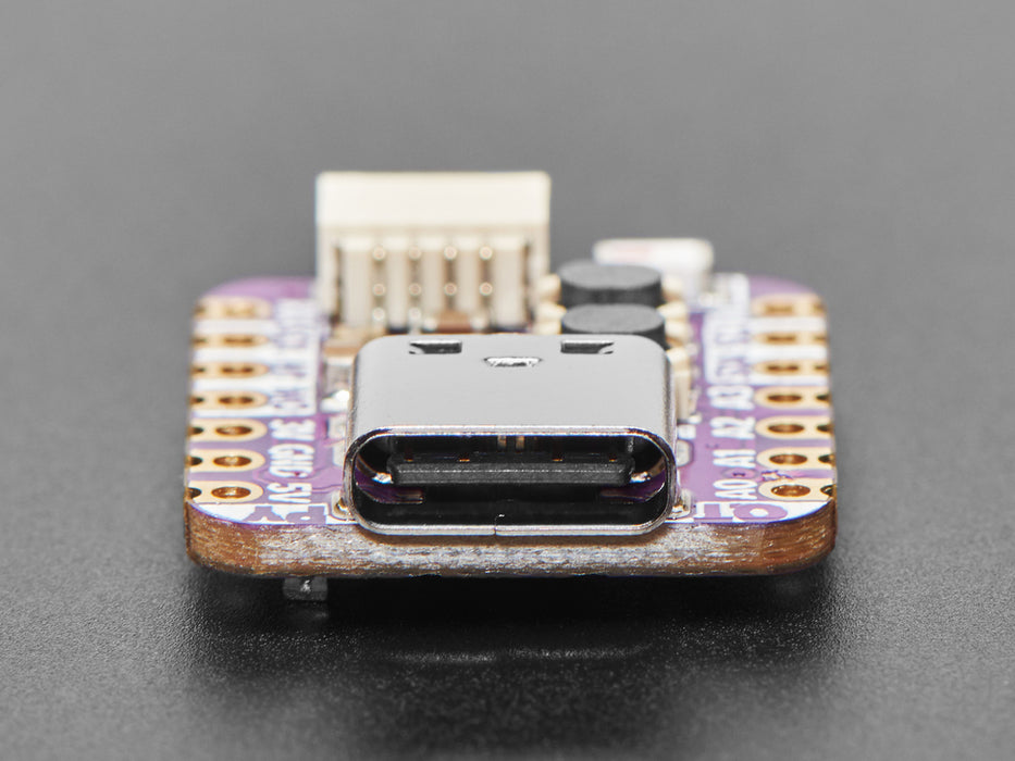 Angled shot of purple, square-shaped microcontroller.