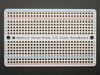 Top view of three fanned out Adafruit Perma-Proto Half-sized Breadboard PCBs.