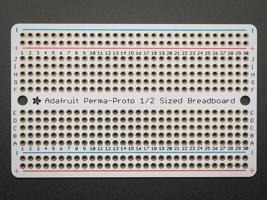 Top view of three fanned out Adafruit Perma-Proto Half-sized Breadboard PCBs.