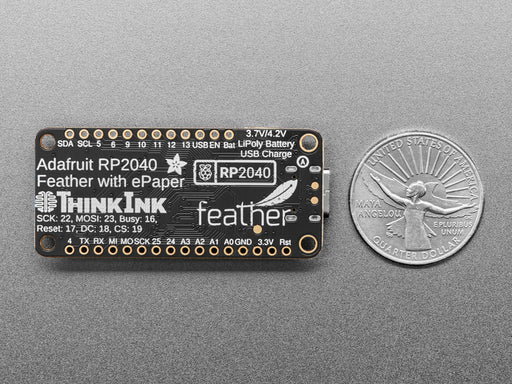 Overhead video of a rectangular microcontroller powering a big e-ink display.