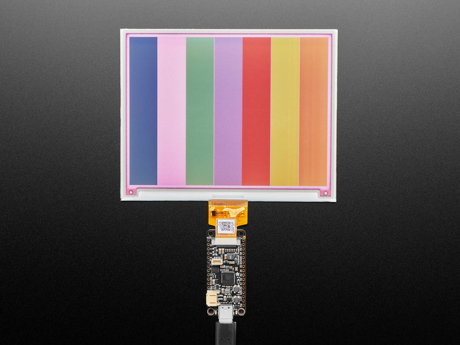 Overhead video of a rectangular microcontroller powering a big e-ink display.