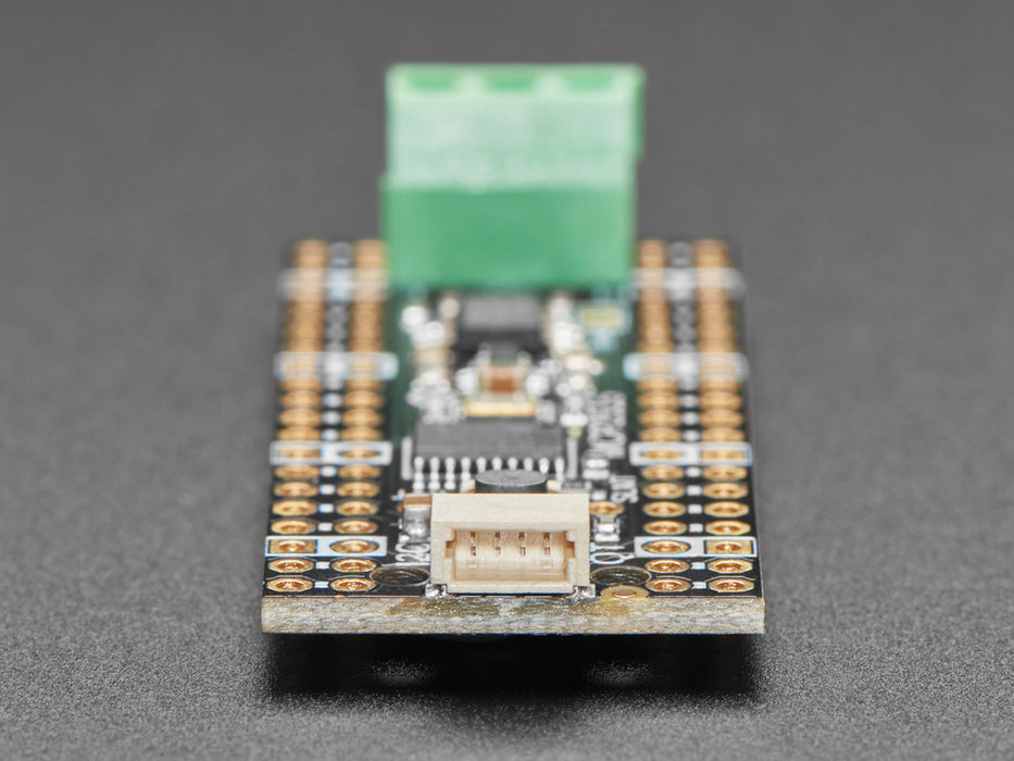 Angled shot of long skinny CAN Bus microcontroller with terminal blocks.