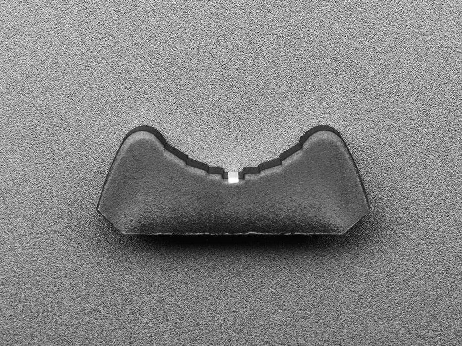 Angled shot of black plastic nubbin on a motorized slide potentiometer.