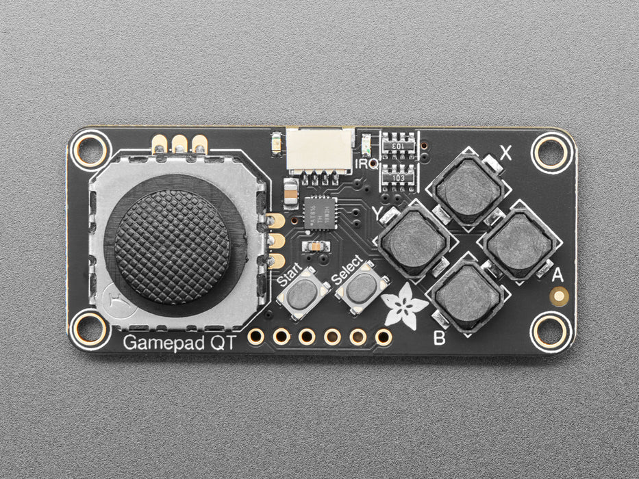 Angled shot of small rectangular gamepad PCB with thumbstick.