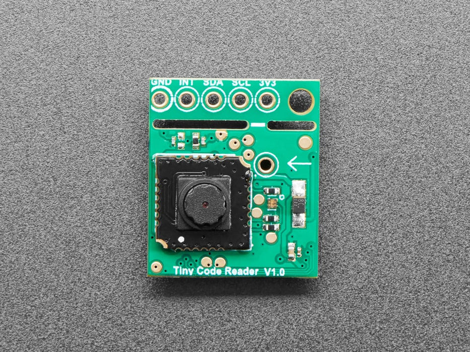 Angled shot of small green QR code reader sensor breakout.