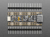 DVI breakout board assembled to a microcontroller in front of a small HDMI monitor. The display shows a flying toasters screensaver.