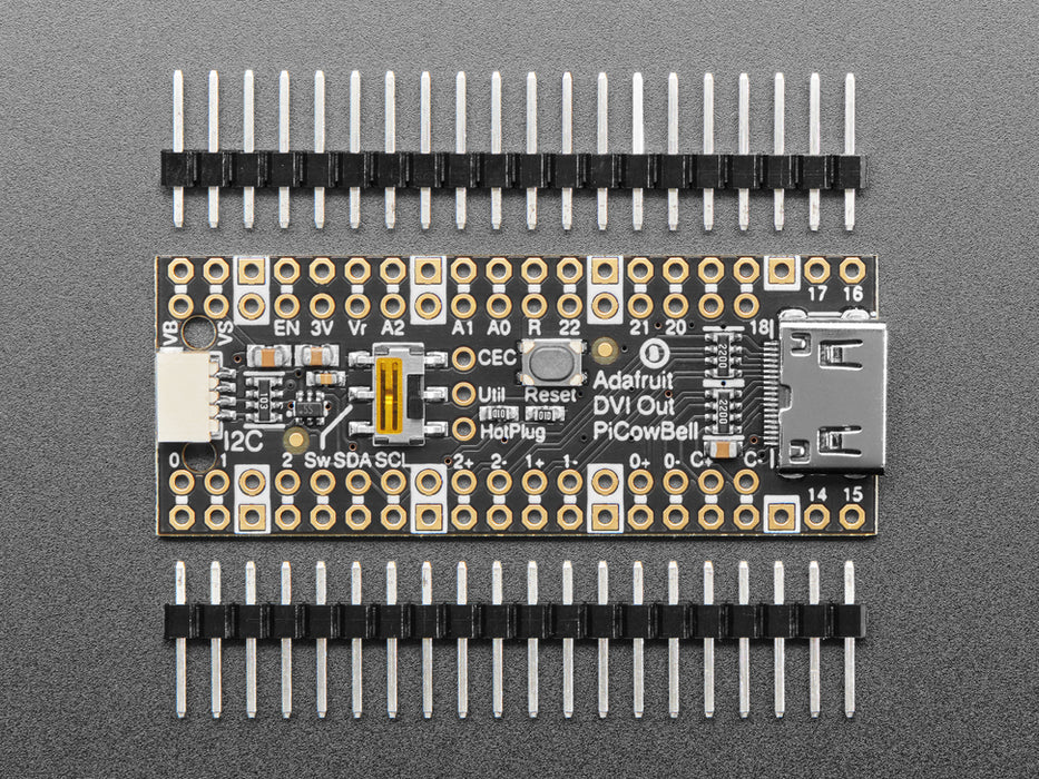 DVI breakout board assembled to a microcontroller in front of a small HDMI monitor. The display shows a flying toasters screensaver.