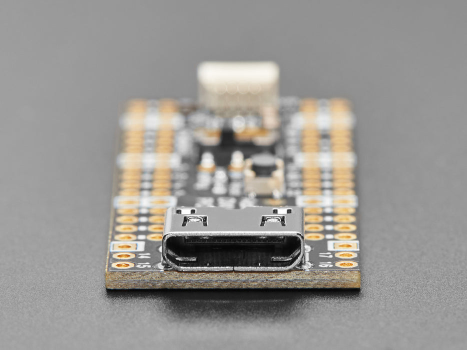 DVI breakout board assembled to a microcontroller in front of a small HDMI monitor. The display shows a flying toasters screensaver.