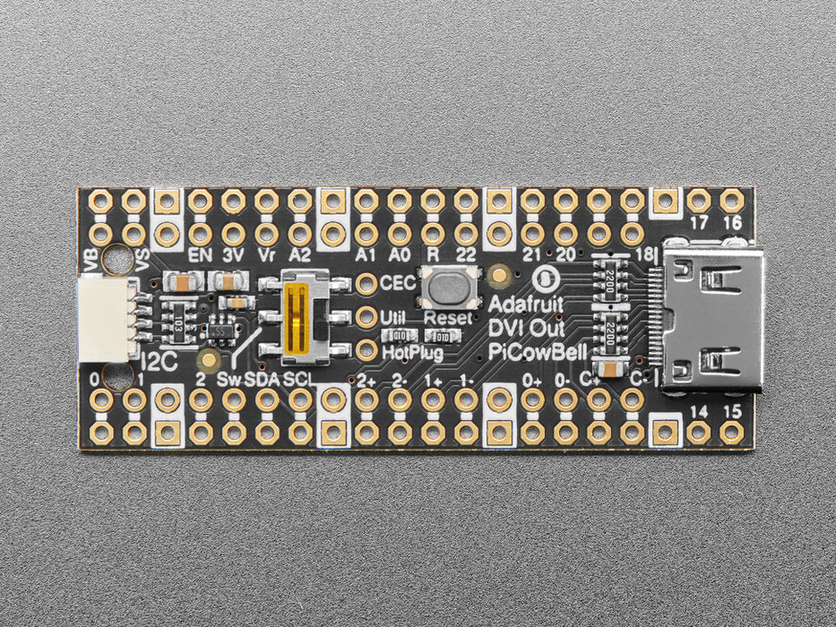 DVI breakout board assembled to a microcontroller in front of a small HDMI monitor. The display shows a flying toasters screensaver.