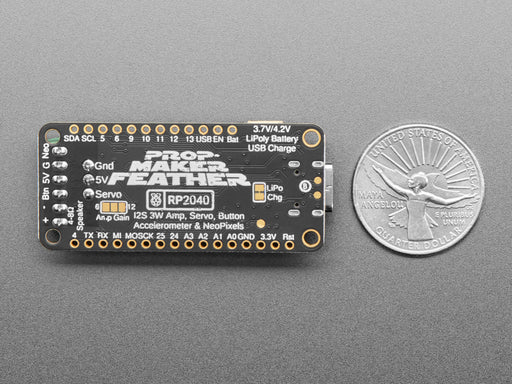 Video of a white hand pressing a button to briefly turn an LED strip into white lights. Also wired up to the microcontroller are a servo motor and a speaker.