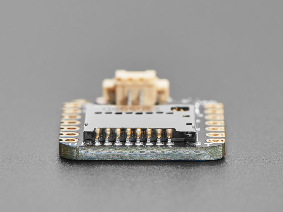 Angled shot of small square audio breakout board.