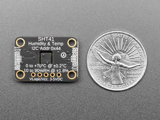 Overhead shot of humidity / temperature sensor breakout connected to an OLD screen, which displays the ambient temperature and humidity.