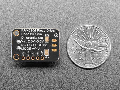 Angled shot of a piezo breakout board wired to a piezo buzzer.