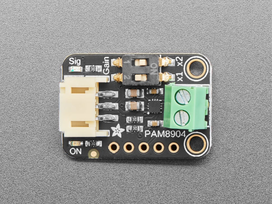 Angled shot of a piezo breakout board wired to a piezo buzzer.