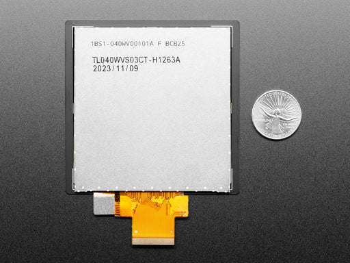 Overhead shot of a 4" square TFT screen connected to a microcontroller. The screen displays a colorful rainbow gradient. A white hand draws a heart on the screen.