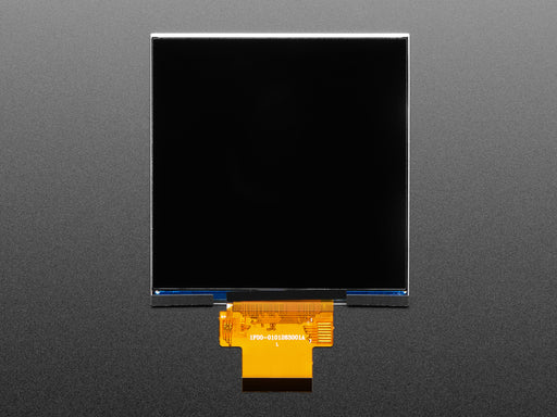 Overhead shot of a 4" square TFT screen connected to a microcontroller. The screen displays a colorful rainbow gradient. A white hand draws a heart on the screen.