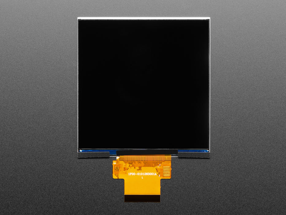 Overhead shot of a 4" square TFT screen connected to a microcontroller. The screen displays a colorful rainbow gradient. A white hand draws a heart on the screen.