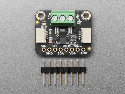 Angled shot of DC current monitor breakout board with green terminal block.