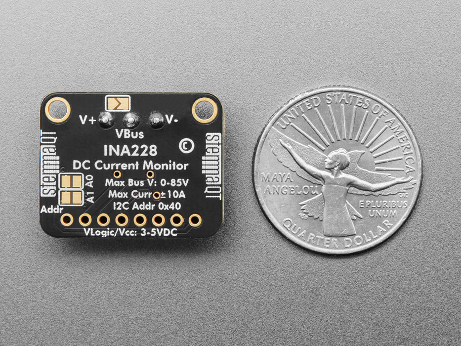 Angled shot of DC current monitor breakout board with green terminal block.