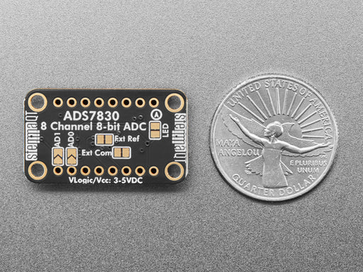 Angled shot of black, rectangular ADC breakout board.