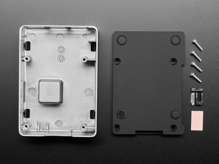 Angled shot of rectangular, aluminum microcontroller enclosure containing a Raspberry Pi computer.