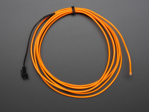 Coil of lit EL wire in orange