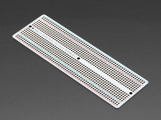 Angled shot of Adafruit Perma-Proto Full-sized Breadboard PCB.