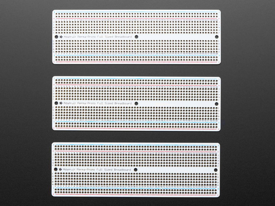 Angled shot of Adafruit Perma-Proto Full-sized Breadboard PCB.