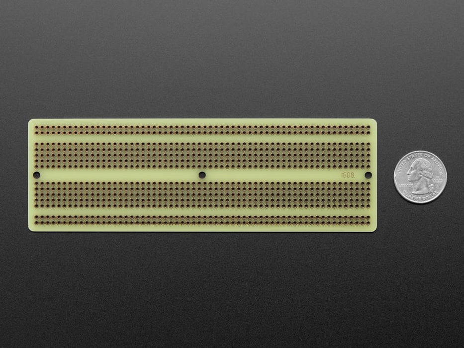 Angled shot of Adafruit Perma-Proto Full-sized Breadboard PCB.