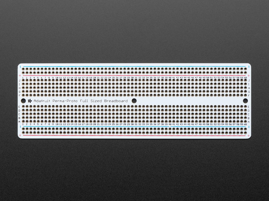 Angled shot of Adafruit Perma-Proto Full-sized Breadboard PCB.