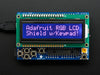 RGB LCD Shield Kit w/ 16x2 Character Display. Display reads "Adafruit RGB LCD Shield w/Keypad!"