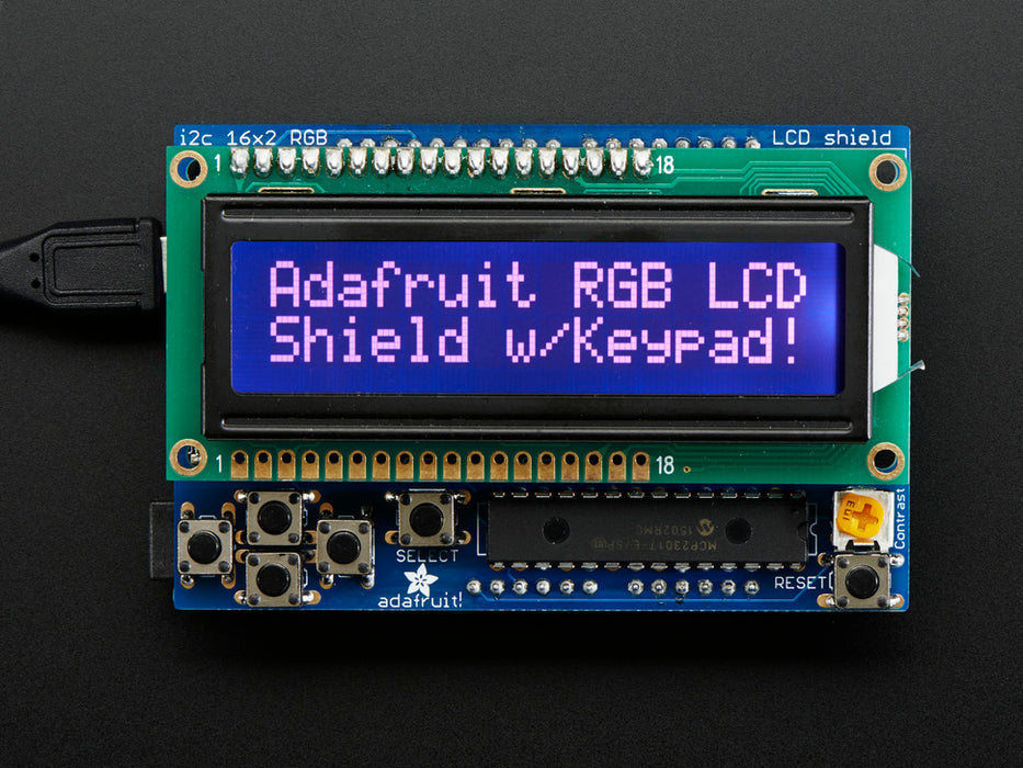 RGB LCD Shield Kit w/ 16x2 Character Display. Display reads "Adafruit RGB LCD Shield w/Keypad!"