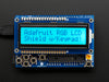 RGB LCD Shield Kit w/ 16x2 Character Display. Display backlight blue and reads "Adafruit RGB LCD Shield w/Keypad!"