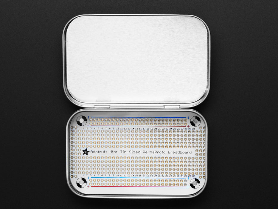 Angled shot of Adafruit Perma-Proto Mint Tin Size Breadboard PCB